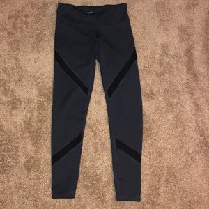 Grey leggings with striped mesh pattern